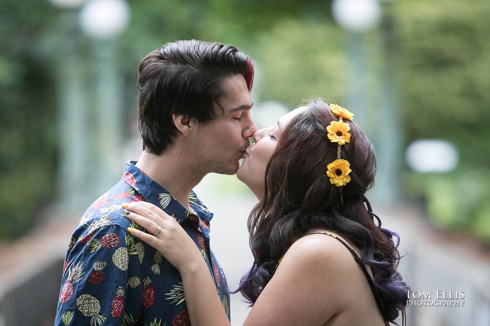 Aimee and Jordan kiss during their Seattle engagement photo session at the Washington Arboretum