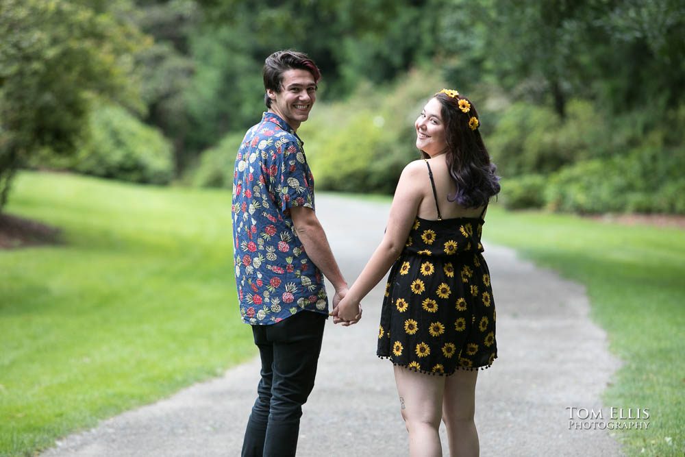 Aimee and Jordan turn to face the camera during their Seattle engagement photo session at the Washington Arboretum