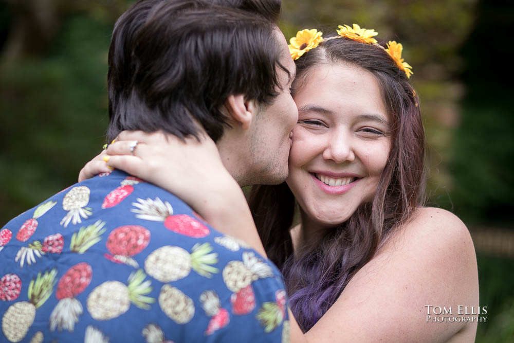 Jordan gives Aimee a kiss on the cheek during our Seattle engagement session at the Washington Arboretum. Tom Ellis Photography, Seattle engagement photographer