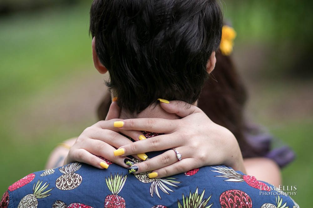 Close up of Aimee's hands and engagement ring during their Seattle engagement photo session at the Washington Arboretum