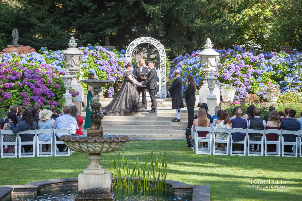 Outdoor wedding ceremony in the formal garden at Thornewood Castle
