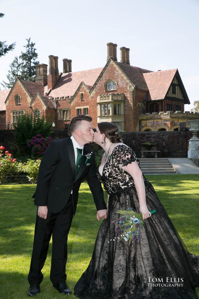 Soon to be married Lisa and Mike share a kiss during their "first look" session just before their wedding ceremony at Thornewood Castle. Tom Ellis Photography