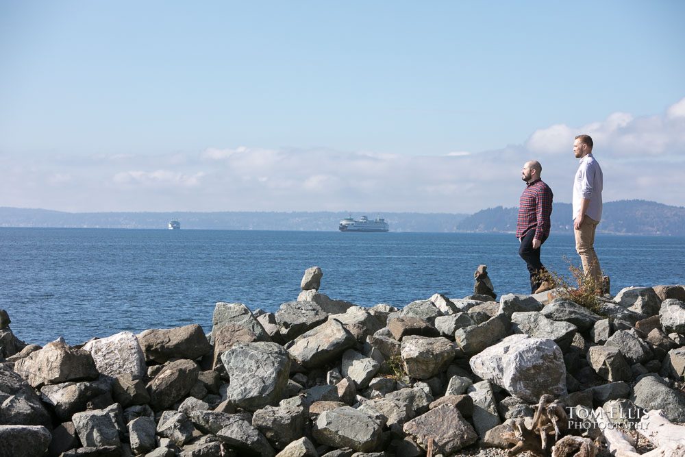 Same sex couple Mike and Ryan on the waterfront near the Olympic Sculpture Garden during their Seattle engagement photo session. Tom Ellis Photography, Seattle engagement photographer