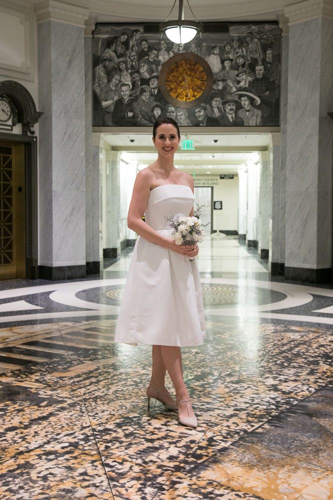 Bride Jocelyn just before her elopement wedding ceremony at the King County Courthouse in Seattle. Tom Ellis Photography, Seattle courthouse wedding photographer