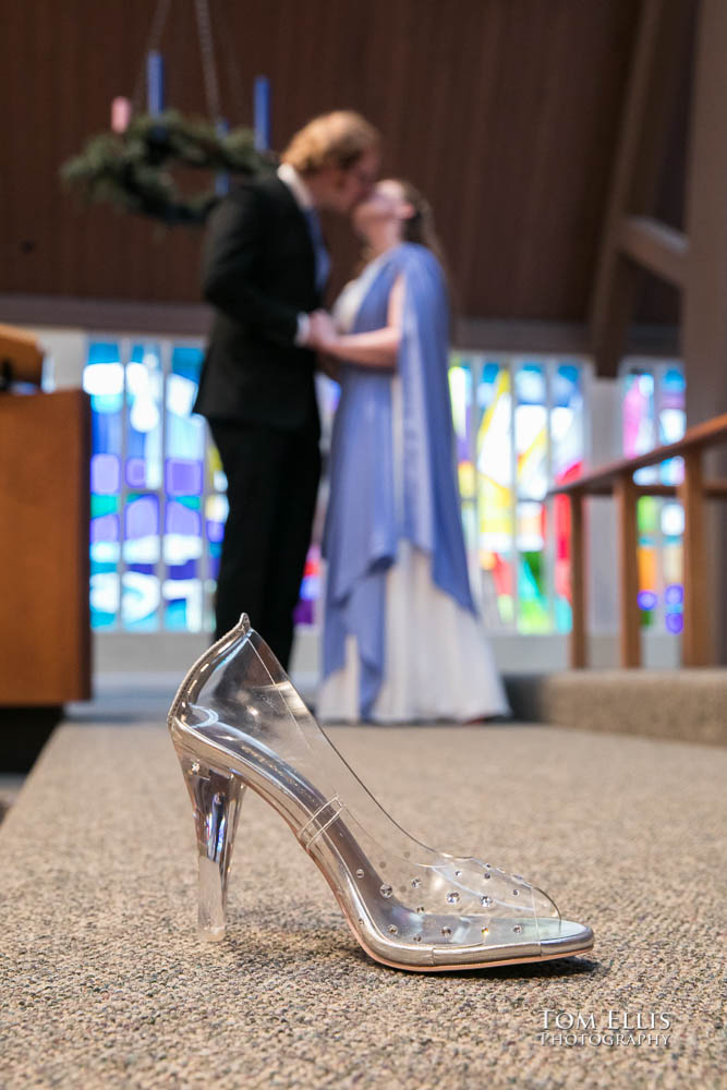 Groom helps bride with her shoe. Fantastic fantasy and science fiction HTTYD wedding - Tom Ellis Photography, Seattle wedding photographer