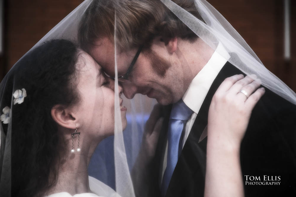 Close up of bride and groom under veil. Fantastic fantasy and science fiction HTTYD wedding - Tom Ellis Photography, Seattle wedding photographer