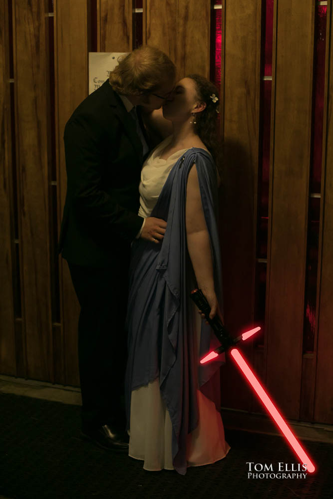 Bride and groom with lightsabers. Fantastic fantasy and science fiction HTTYD wedding - Tom Ellis Photography, Seattle wedding photographer