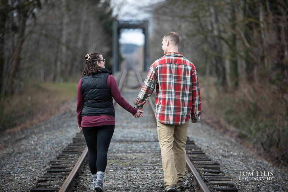Snoqualmie Falls surprise proposal and engagement session - Ben and Sammy on the railroad tracks