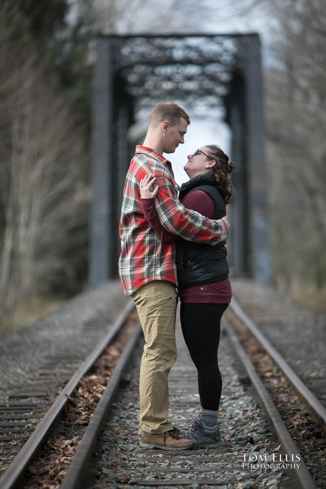Snoqualmie Falls surprise proposal and engagement session - Ben and Sammy in front of the trestle