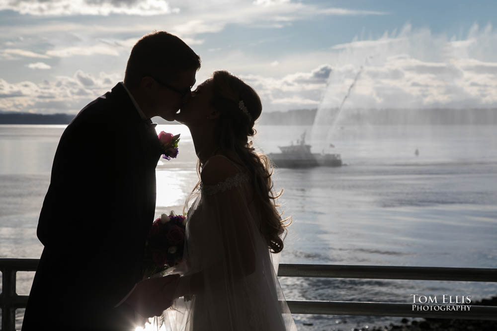 Bride and groom light their Unity candle at their Seattle area wedding at Ray's Boathouse. Tom Ellis Photography