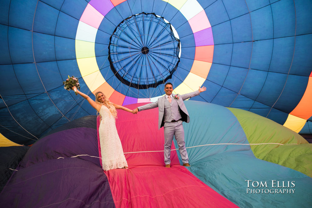 Bride Christin and groom Jean inside their ballooon as it was being inflated for their elopement wedding ceremony. Tom Ellis Photography