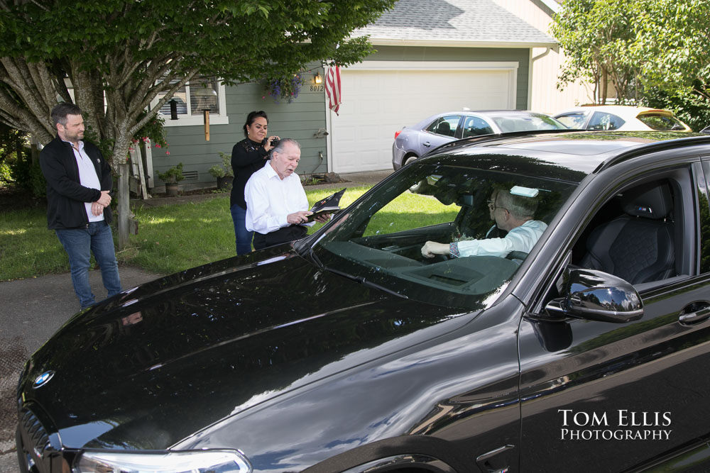 Liliana and Greg's quarantine elopement ceremony in their car. Tom Ellis Photography, Seattle elopement photographer.