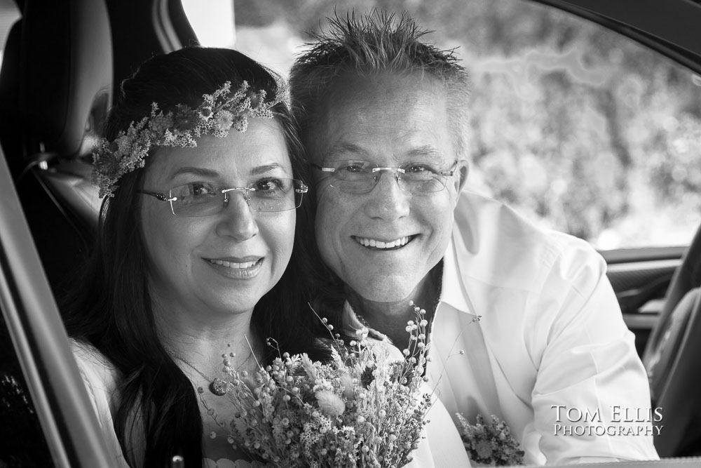 Liliana and Greg inside their car during their Covid wedding in Seattle. Tom Ellis Photography, Seattle wedding photographer