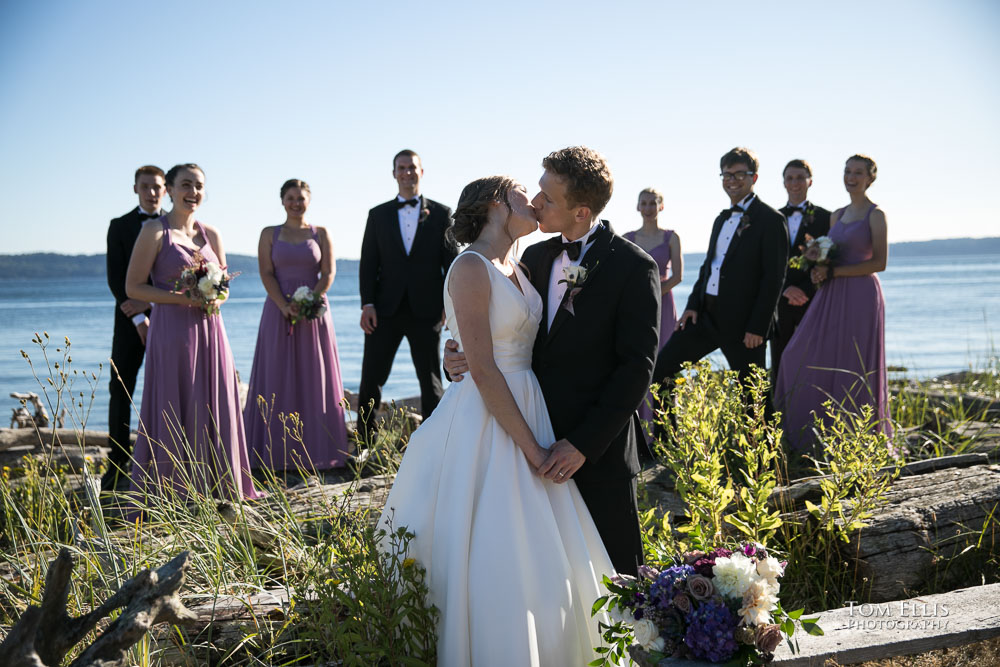 Bride Allison and groom Matthew on the beach with their wedding party during their Seattle Covid wedding. Tom Ellis Photography, Seattle wedding photographer