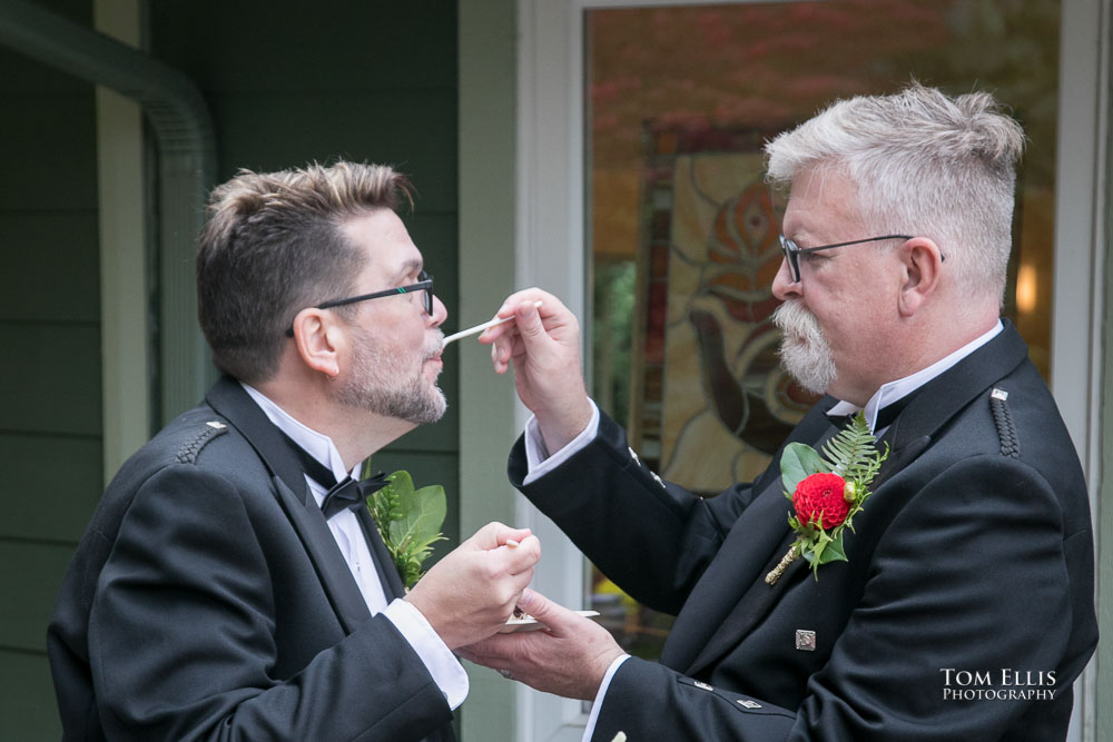 The cake cutting. Sensational Seattle same-sex LGBTQ wedding. Tom Ellis Photography, Seattle Wedding Photographer