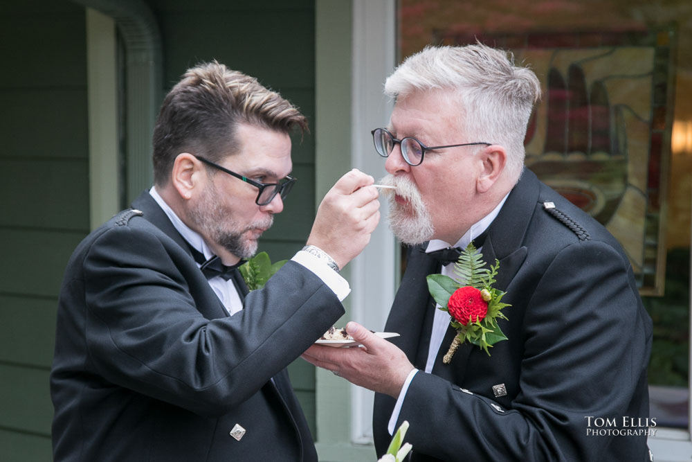 The cake cutting. Sensational Seattle same-sex LGBTQ wedding. Tom Ellis Photography, Seattle Wedding Photographer