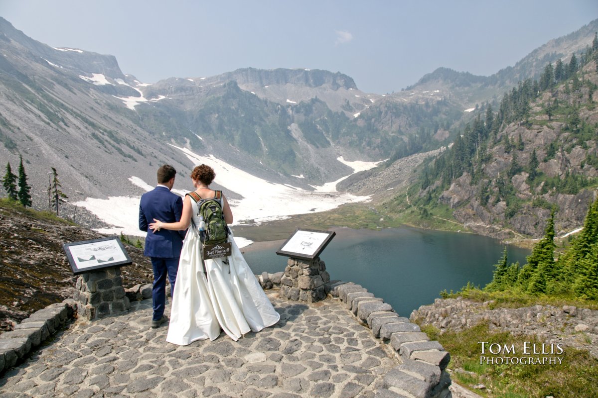 Leigh and Kory at a viewpoint at Heather Meadows on Mt. Baker, where they had their adventure elopement wedding. Tom Ellis Photography, Seattle adventure and destination photographer.