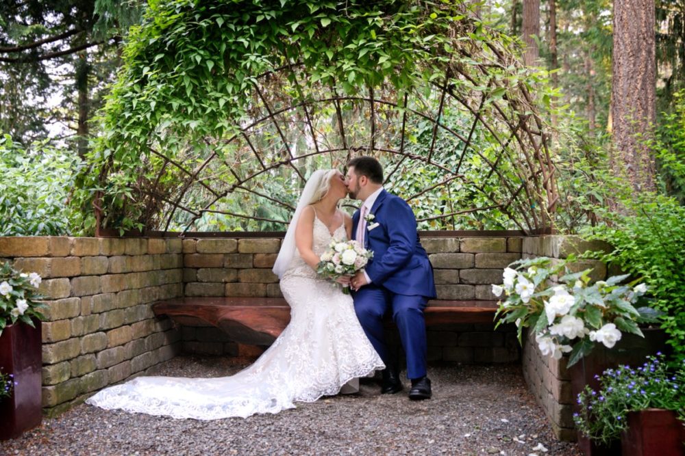 David and Kelly share a kiss after their destination wedding ceremony