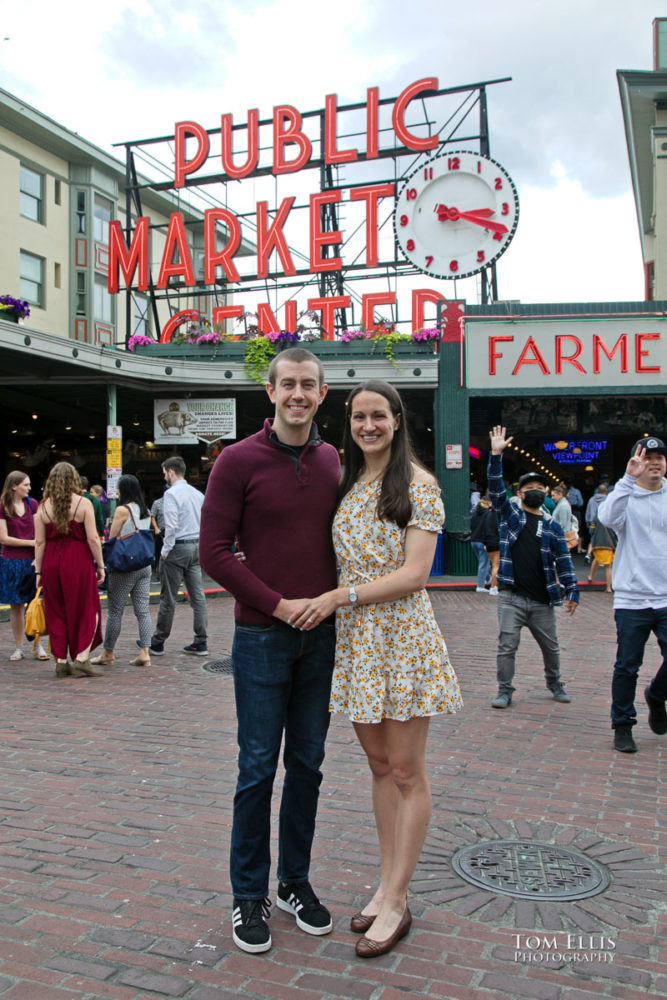 Sarah and Jacob in Pike Place Market during out pre-wedding photo session. Tom Ellis Photography, Seattle engagement photographer