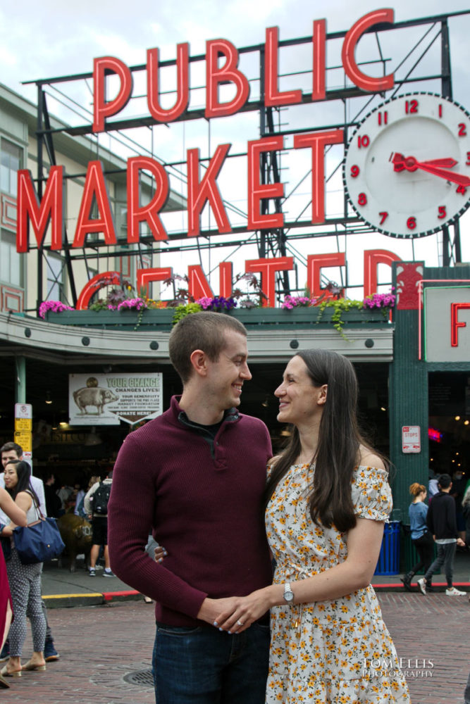 Sarah and Jacob in Pike Place Market during out pre-wedding photo session. Tom Ellis Photography, Seattle engagement photographer