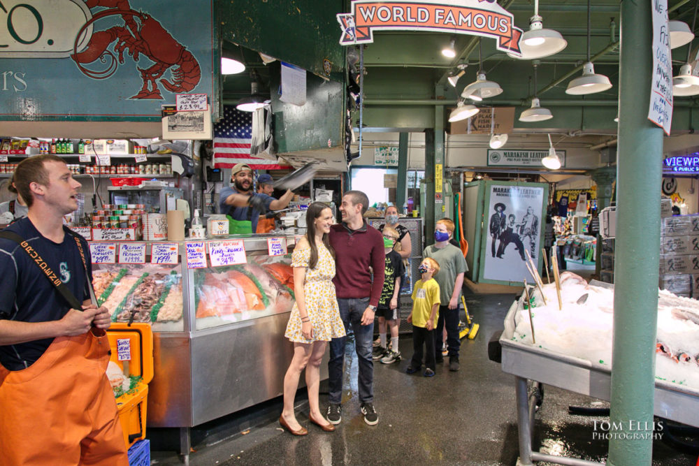 Sarah and Jacob in Pike Place Market during out pre-wedding photo session. Tom Ellis Photography, Seattle engagement photographer