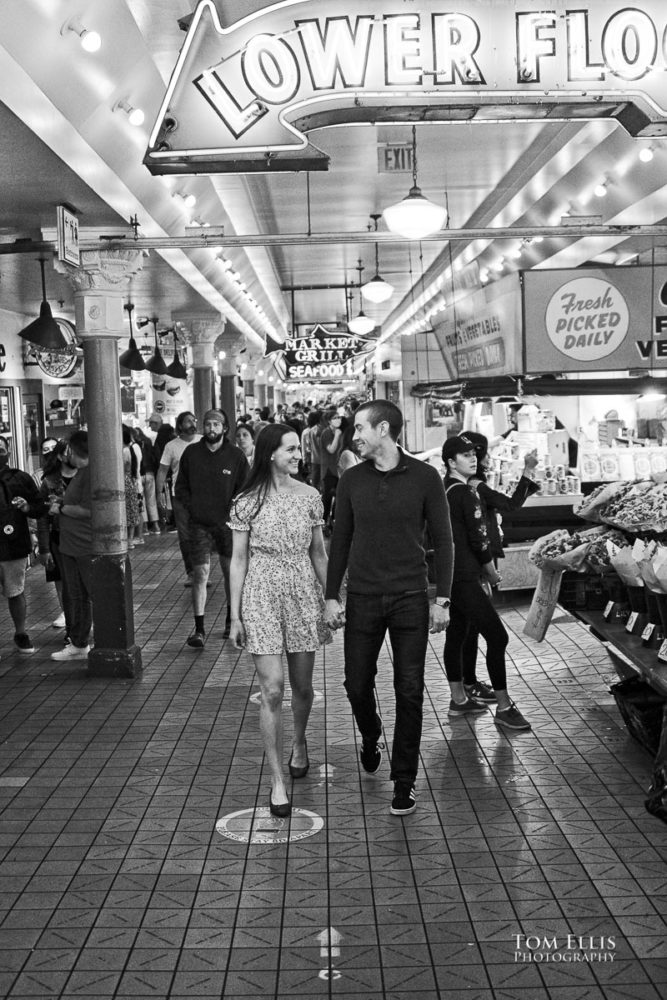 Sarah and Jacob in Pike Place Market during out pre-wedding photo session. Tom Ellis Photography, Seattle engagement photographer