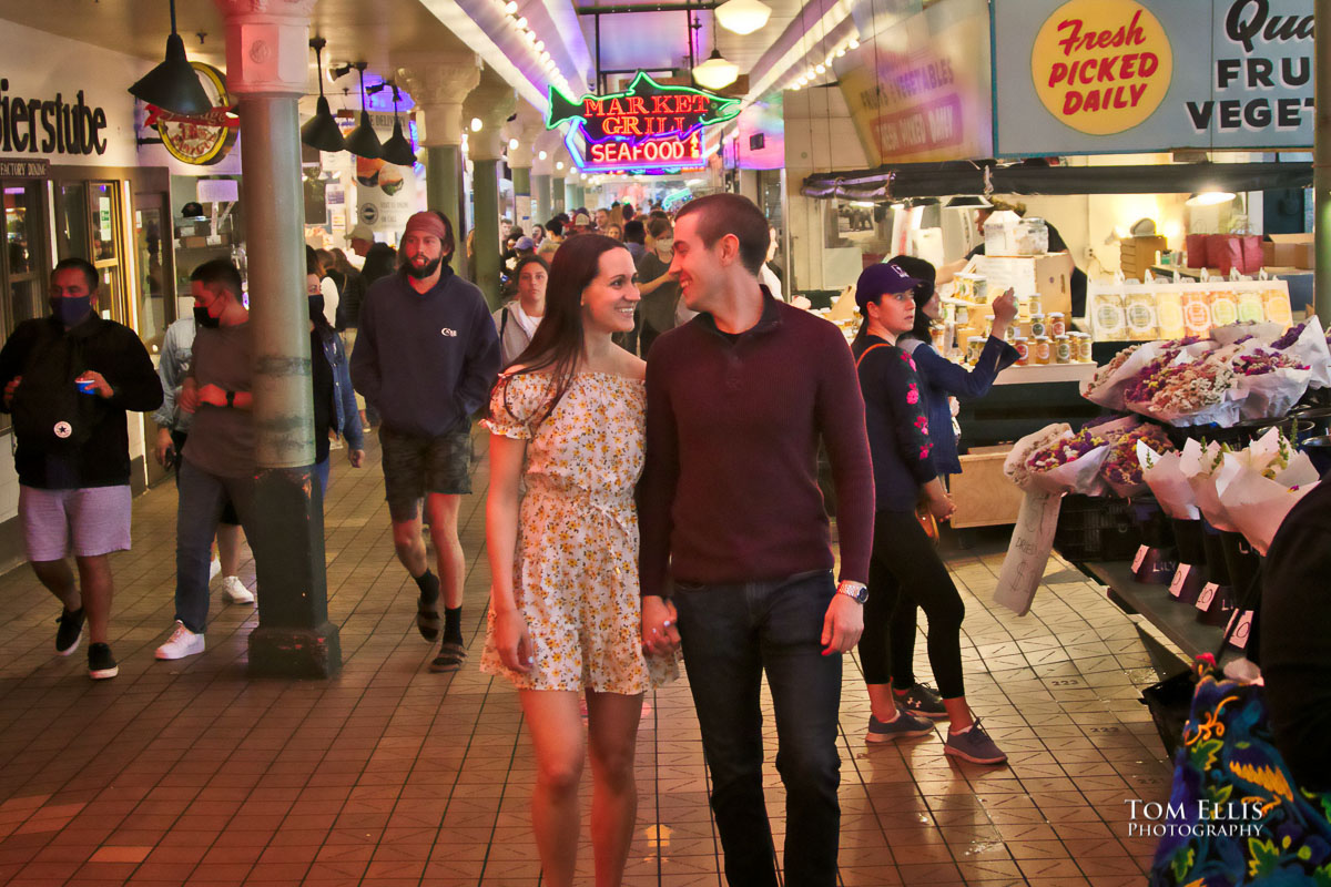 Sarah and Jacob in Pike Place Market during out pre-wedding photo session. Tom Ellis Photography, Seattle engagement photographer