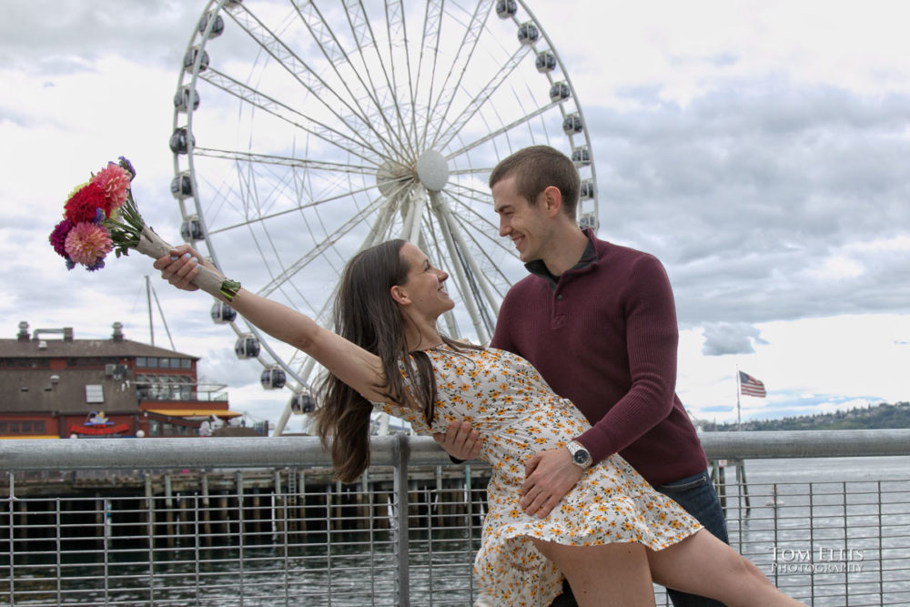 Sarah and Jacob in Pike Place Market during out pre-wedding photo session. Tom Ellis Photography, Seattle engagement photographer