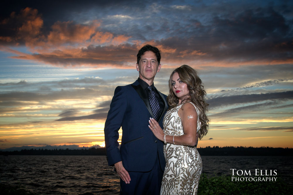 Zena and Alan on the waterfront at sunset during their wedding at the Woodmark Hotel. Tom Ellis Photography, Seattle wedding photographer
