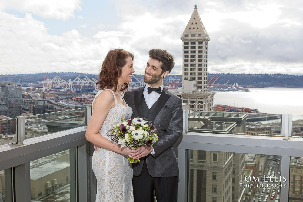 Tori and Jonathon on the balcony of the Seattle Municipal Courthouse before their elopement wedding. Tom Ellis Photography