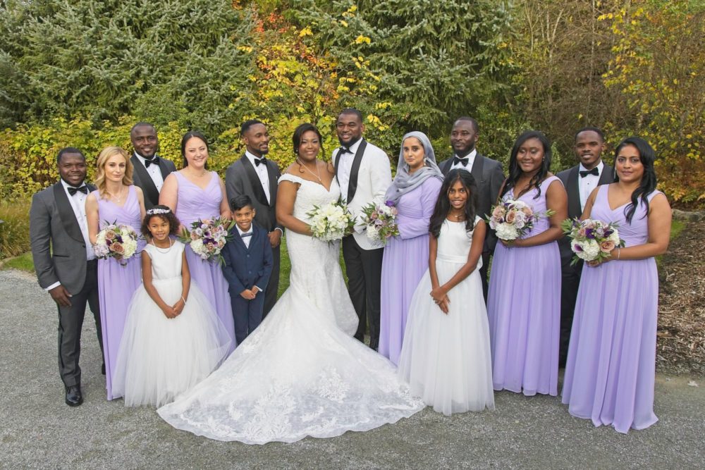 Sue and Shananun pose with their wedding party before their wedding ceremony at Willows Lodge. Tom Ellis Photography, Seattle wedding photographer