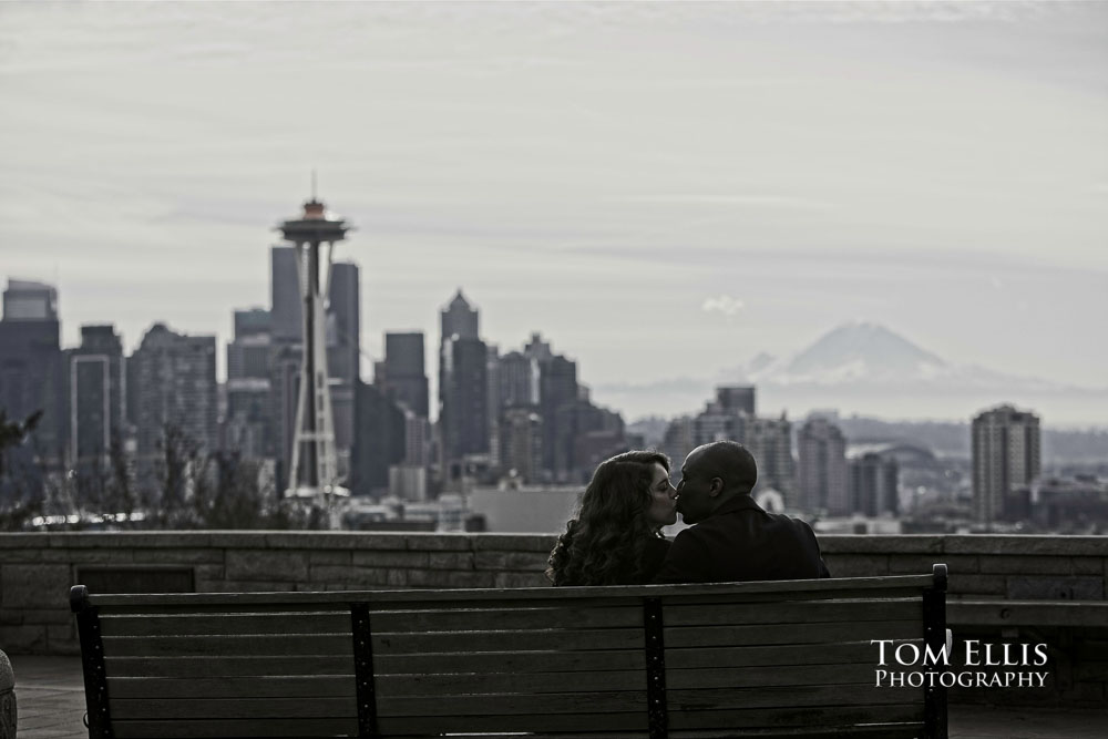 JJ and Jessica sit on a bench at Kerry Park after JJ's surprise proposal. Tom Ellis Photography, Seattle engagement photographer