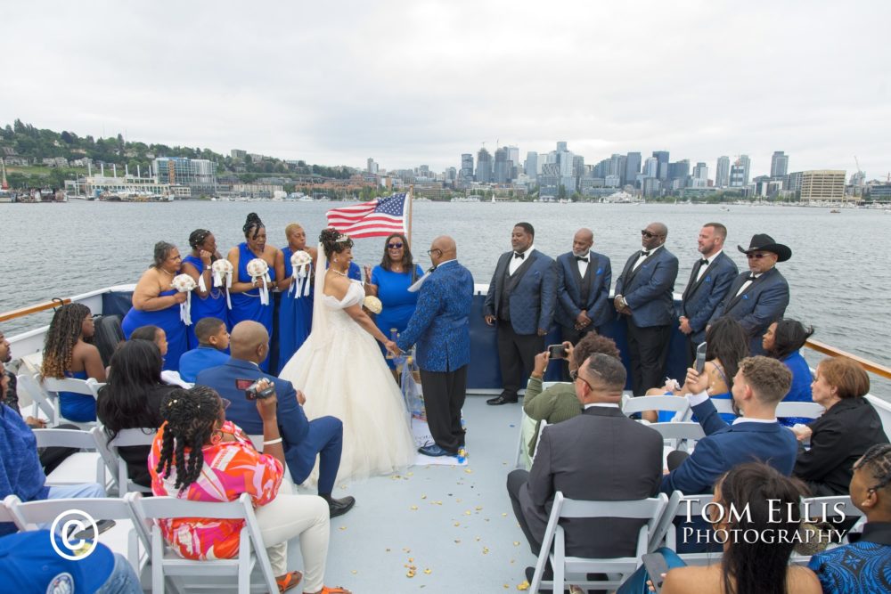 Venita and Mike get married on the stern of the Emerald Star on Lake Union in Seattle. Tom Ellis Photography, Seattle wedding photographer