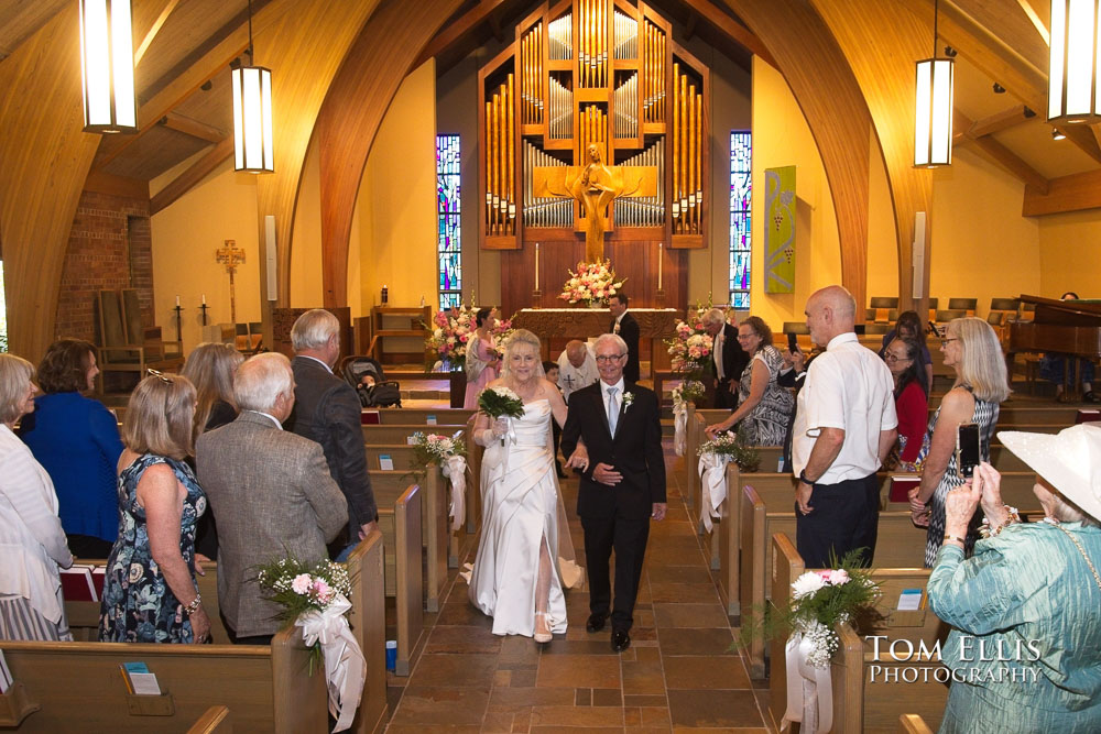 Aida and John come down the aisle at the conclusion of their wedding ceremony at Magnolia Lutheran Church. Tom Ellis Photography, Seattle wedding photographer