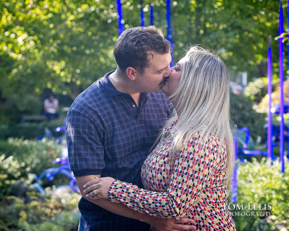 Thomas proposes to Mateja at Chihuly Garden and Glass in Seattle. Tom Ellis Photography, Seattle engagement and proposal photographer